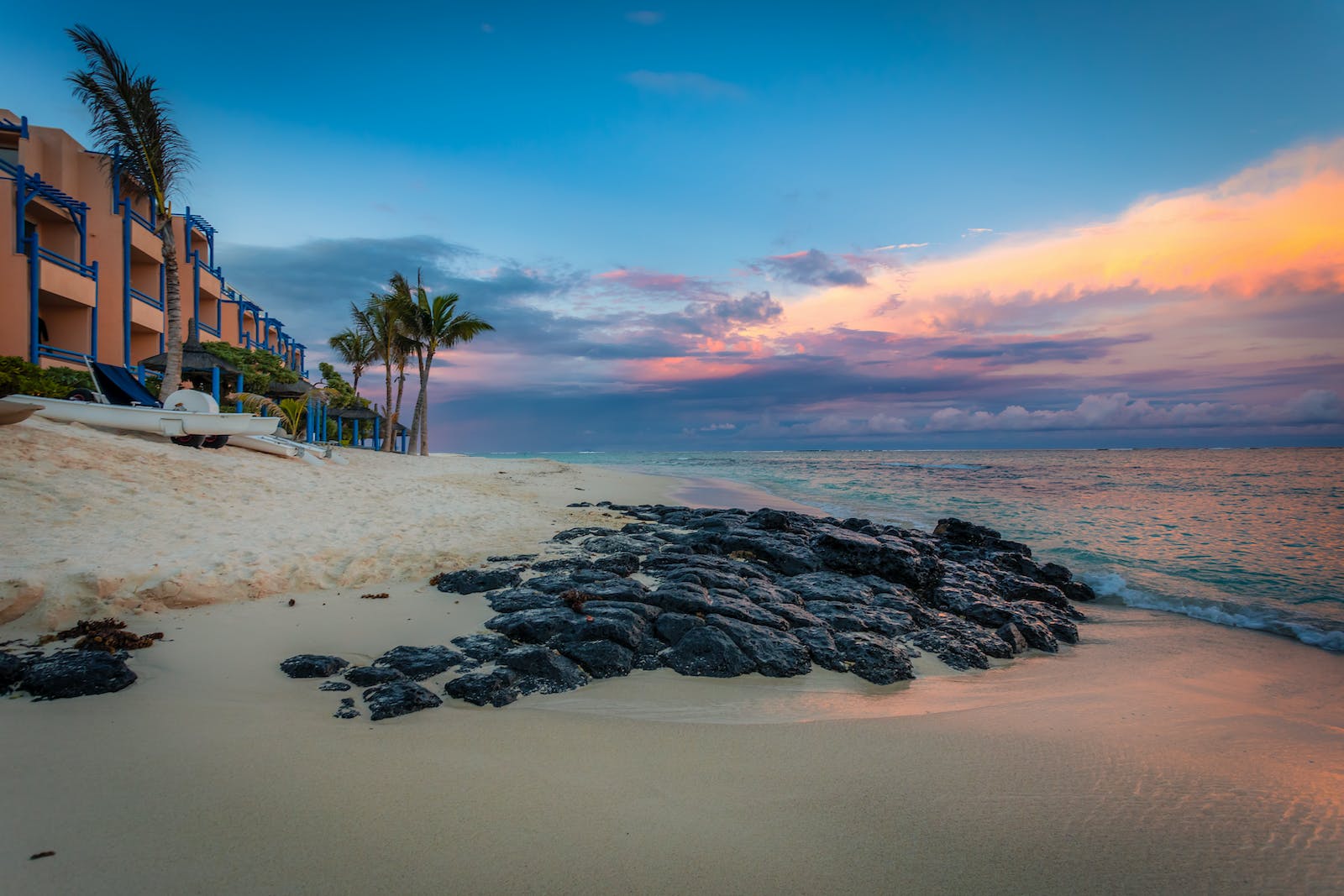 Rocks on Seashore Near a Resort